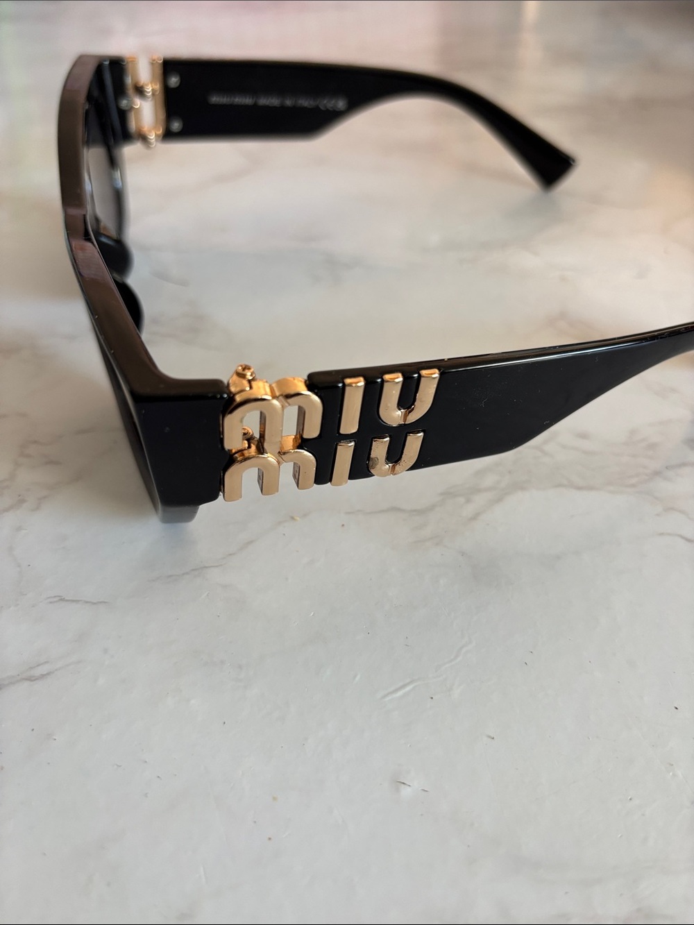 Miu Miu Black Sunglasses with Gold Logo Accent on Temples